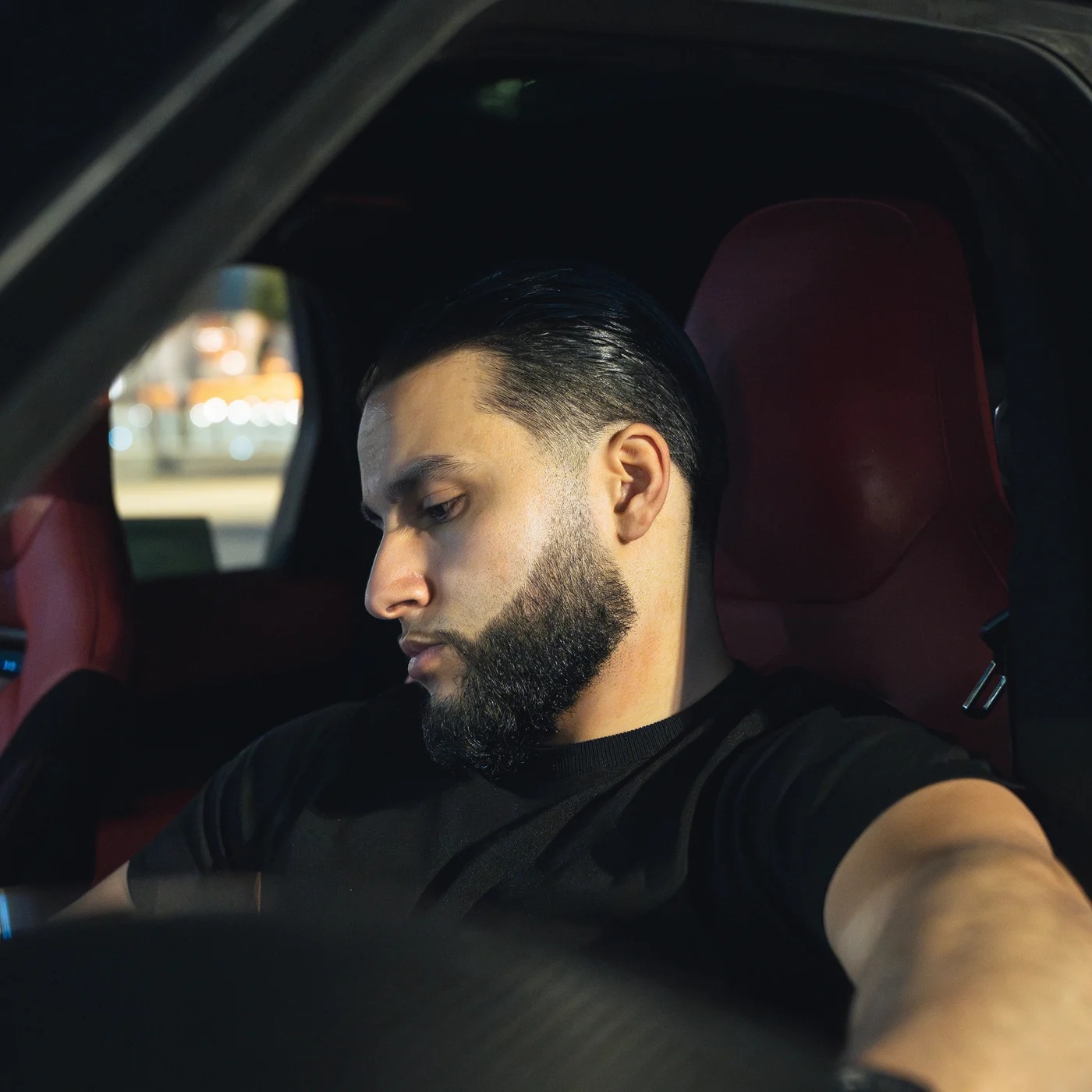 Zack Lalouti seated in a car.