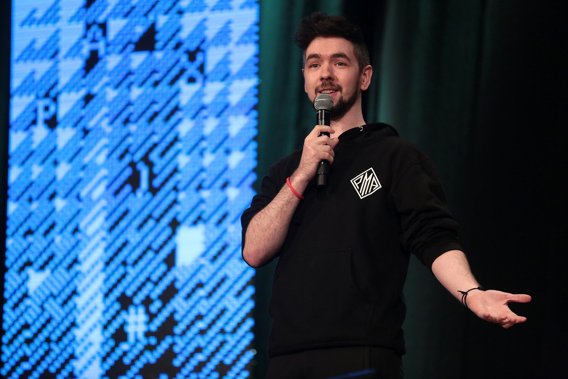 Jacksepticeye speaking with attendees at the 2018 PAX West at Benaroya Hall in Seattle, Washington.
