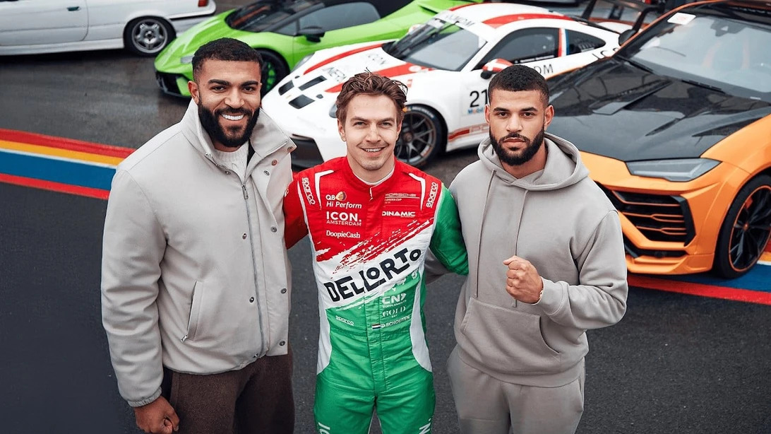 Ruben and Samuel Onuha with a racing driver.