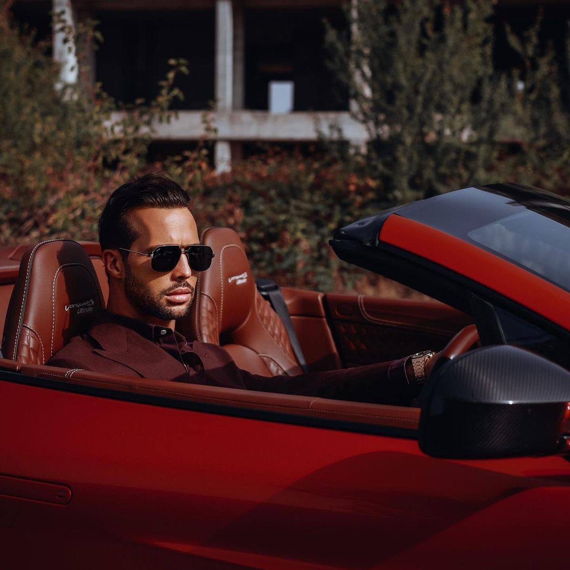 Tristan Tate seated in a convertible.