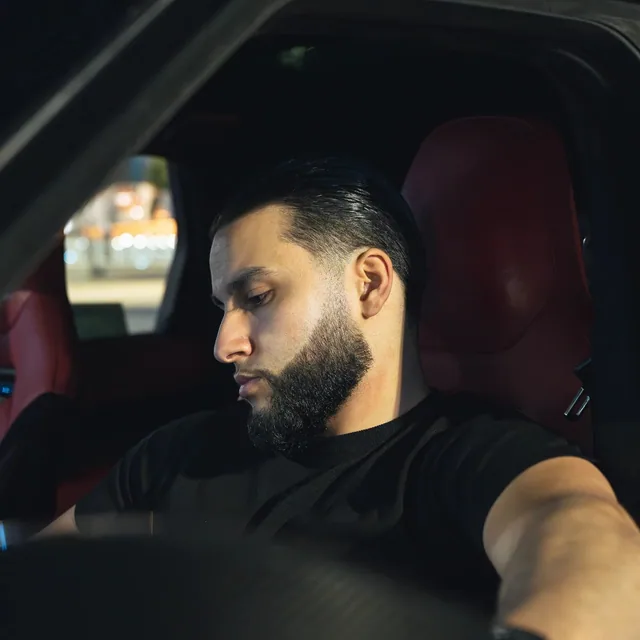 Zack Lalouti seated in a car.